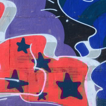 Fragment of graffiti drawings. The old wall decorated with paint stains in the style of street art culture. Colored background texture in cold tones photo