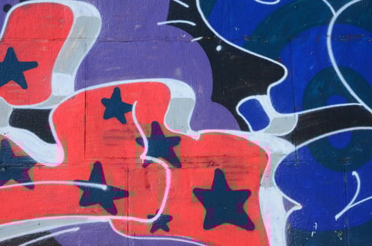 Fragment of graffiti drawings. The old wall decorated with paint stains in the style of street art culture. Colored background texture in cold tones photo
