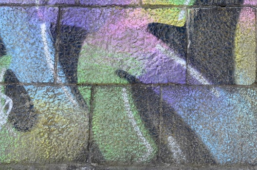 Fragment of graffiti drawings. The old wall decorated with paint stains in the style of street art culture. Multicolored background texture photo