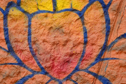 Fragment of graffiti drawings. The old wall decorated with paint stains in the style of street art culture. Orange flower photo