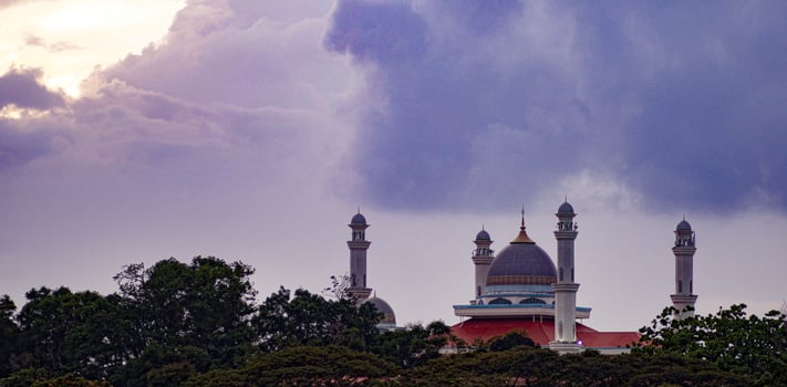 A view of Marang Mosque with beautiful cloud and sunset photo
