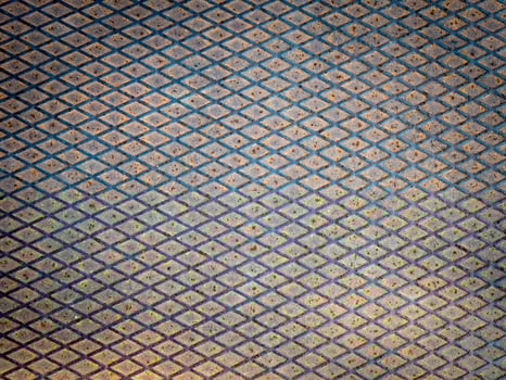 Industrial old rusted metal steel sheet with rhombus shapes. Rusty metal background photo