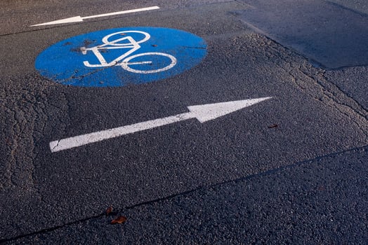 bicycle lane sign on the road photo