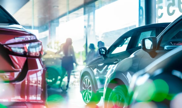 New SUV car in modern luxury showroom on blur saleswoman and customer. Car dealership office concept. Dealer agent business. Automobile leasing service. Dealer company. New car purchase. Auto sale. photo