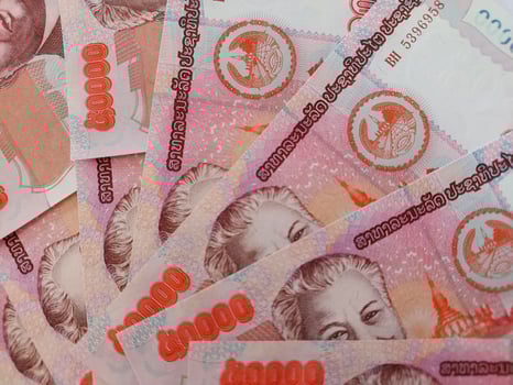 Laos Kip banknotes close-up. Money background. Laos currency - Kip. Pattern texture and background of Laos Kip money, currency banknotes ready for exchange and business investment. photo