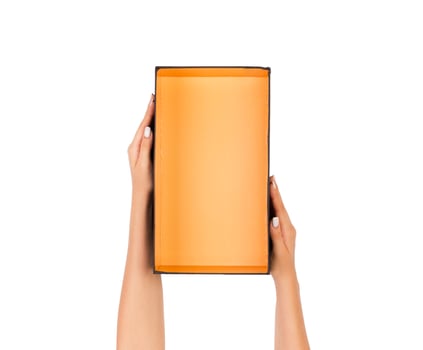 hand holding orange paper box package isolated on white background photo