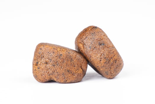 pressed cannabis hash cubes isolated on white background photo