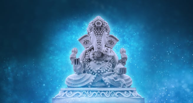 Selective focus on statue of Lord Ganesha, Ganesha Festival. Hindu religion and Indian celebration of Diwali festival concept on dark, red, yellow background. photo
