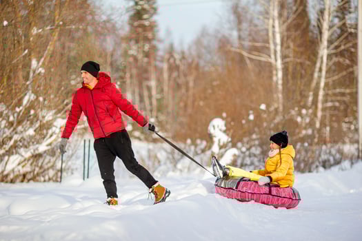 Family of dad and kids vacation on Christmas eve outdoors photo