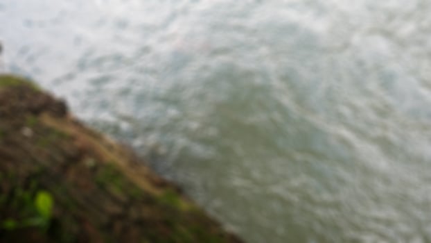 wavy water with bark as background photo