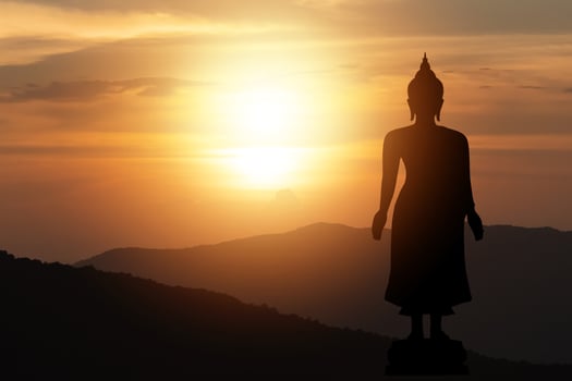 Silhouette big buddha statue sun shining from behind mountain sky sunset background.Makha Bucha Day, Vesak Day, Asanha Bucha, Buddhist Lent. Religion buddha concept. photo
