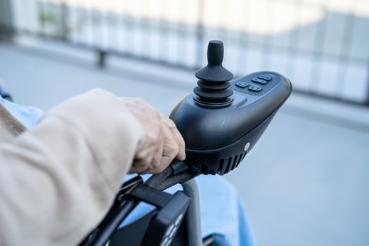 Asian senior or elderly old lady woman patient on electric wheelchair with remote control at nursing hospital ward, healthy strong medical concept photo