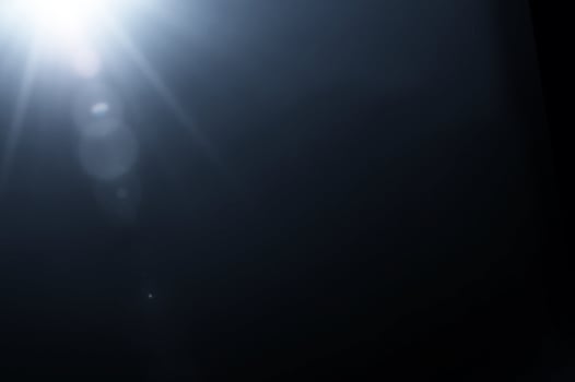 Sun flare through the lens. Background to overlay. photo