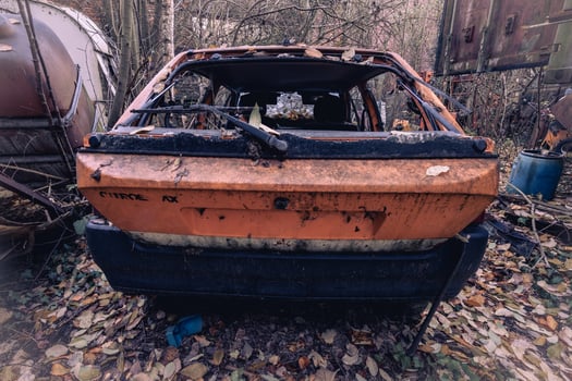 Old abandoned cars dumped in the Forest somewhere in Belgium. photo