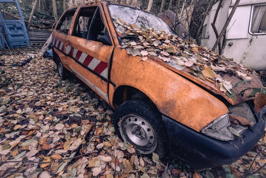 Old abandoned cars dumped in the Forest somewhere in Belgium. photo