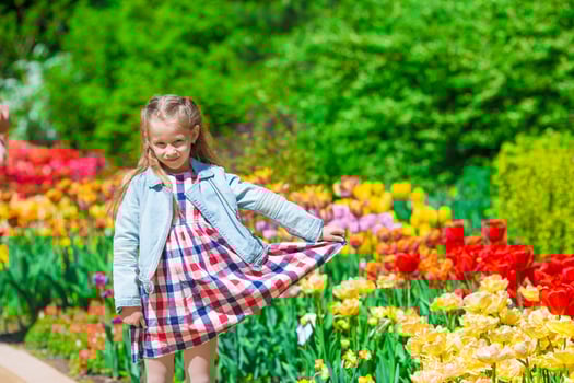 Spring garden, spring flowers - lovely girl and tulips photo