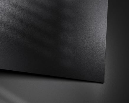 Logo mockup on black paper angle view photo