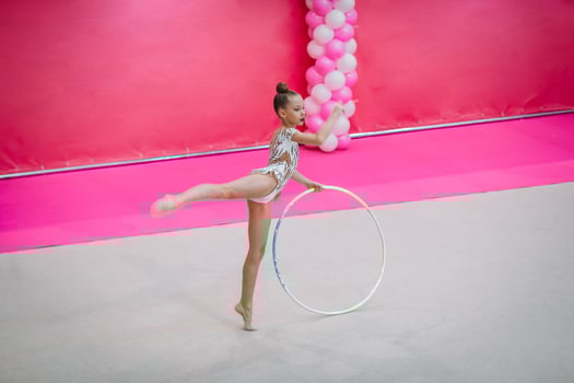 Little gymnast training on the carpet and ready for competitions photo