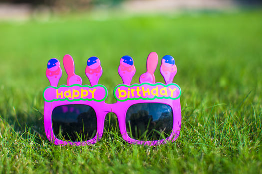 Red Happy Birthday Glasses on the grass photo