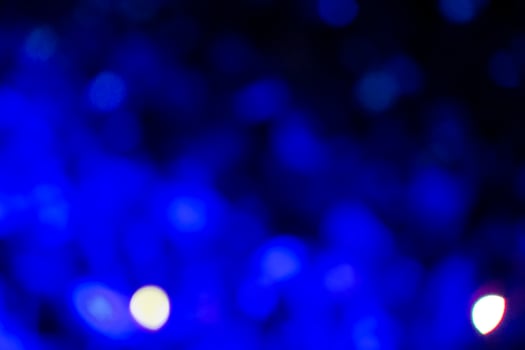 Dark blue spots of large bokeh.Blue background. photo