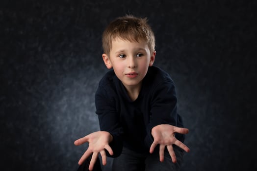 Funny little boy shows his hands.Child at four years old. photo