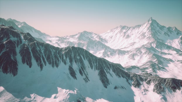 Aerial View from Airplane of Blue Snow Covered Canadian Mountain Landscape photo