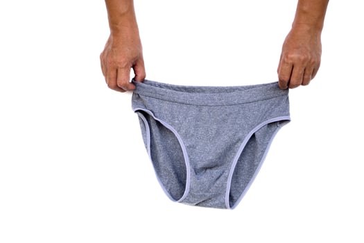 Man's hands hold gray underwear pants for men isolated on white background. Concept , Clothes and costume. Men fashion. Everyday wearing. photo
