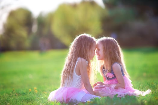 Adorable little girls on spring day outdoors photo
