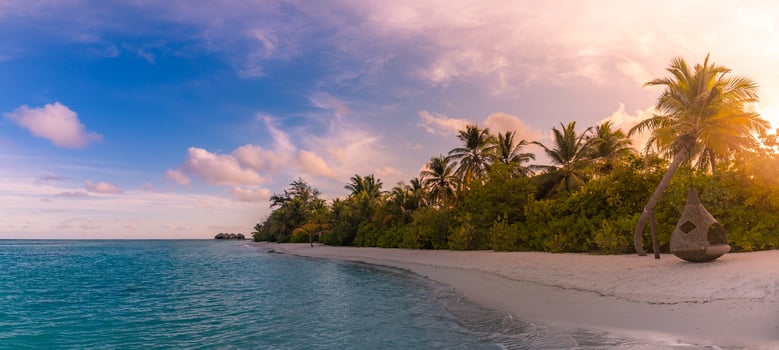 Panorama view on beautiful sunset and tropical beach. Idyllic, peaceful panoramic landscape, relaxing tropical nature. Exotic beach scenery, wonderful summer mood. Luxury vacation holiday banner photo