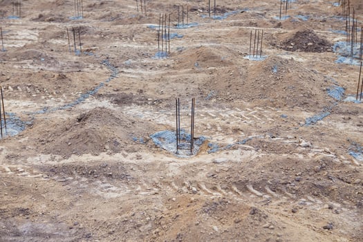 Foundation site of new building, details and reinforcements with steel bars and wire rod, preparing for cement pouring. photo