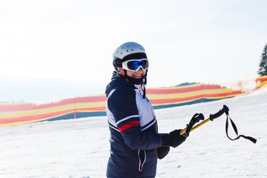 Woman skier enjoy in winter sunny day, holiday photo