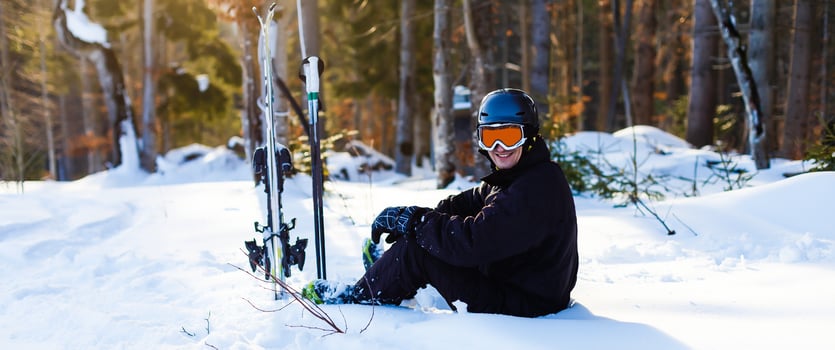 skier looking at snow covered mountains photo