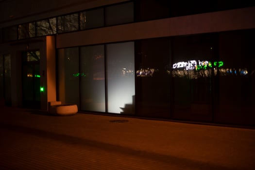 Light in display case at night. Light from building. Showcase details. photo