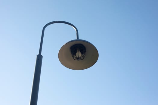 Pole with lamp. Street light. Lamp against sky. Details of urban infrastructure. photo