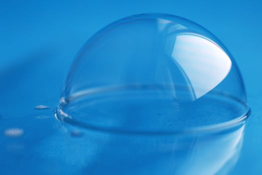 soap bubble close up. abstract blue water background photo