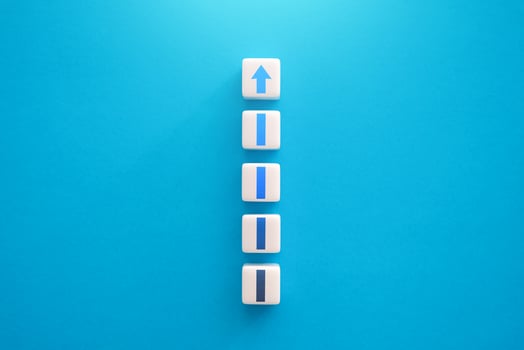 Rise and growth process . Blocks with a growing arrow. Go higher for success, self development. Make progress concept. Move up step by step. Upgrade, level up. Career promotion. photo