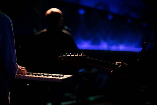 Musicians on stage. Playing musical instruments. Rock band performance. photo