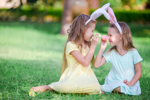 Kids in bunny ears have fun on Easter day outdoors photo