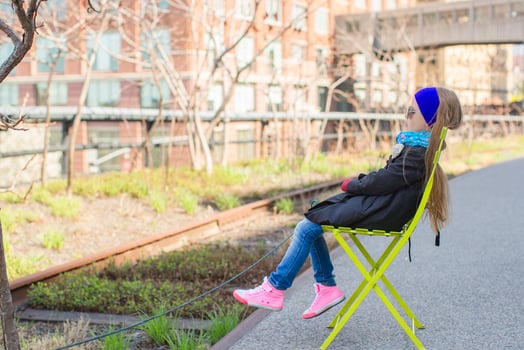 Adorable little girl enjoy sunny day on New York's High Line photo