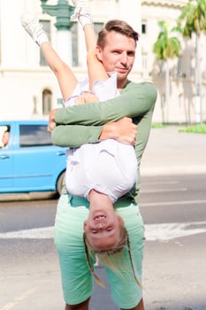 Family in popular area in Old Havana, Cuba. Little kid and young dad outdoors on a street of Havana photo