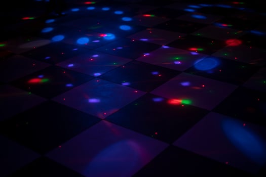 Color music at disco. Dance floor in club. Interior of room with illumination. photo