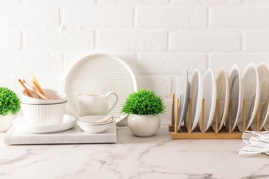 Beautiful kitchen background for design. various modern utensils against the background of a white brick wall and indoor green plants in pots. photo