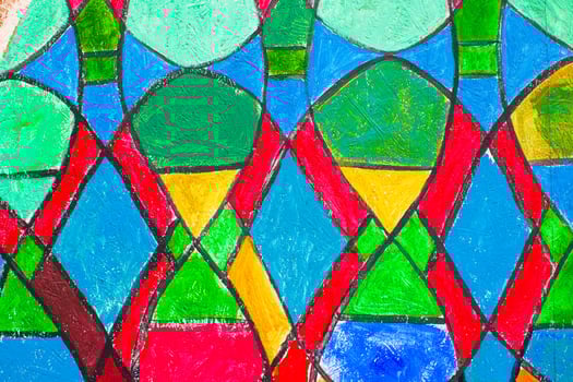 Stained glass church window in reddish tone photo
