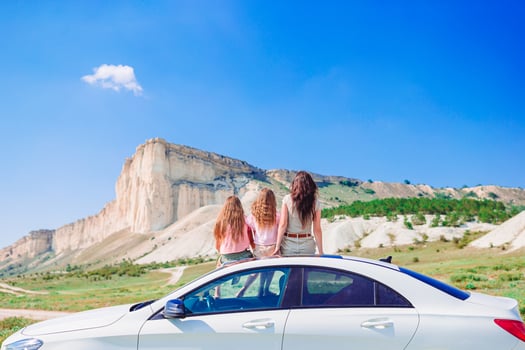 Mother and little daughters on summer car vacation photo