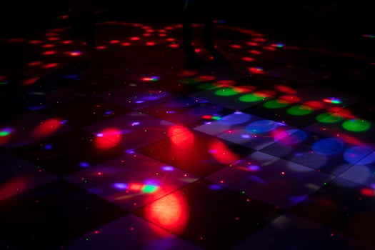 Disco dance floor. Light on dance floor. Colored spots on floor. Lights from spotlight. photo