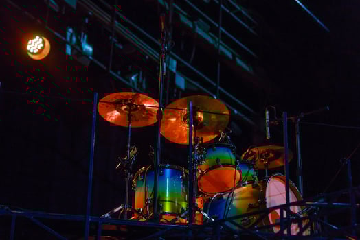 Set of drums on stage, black background photo