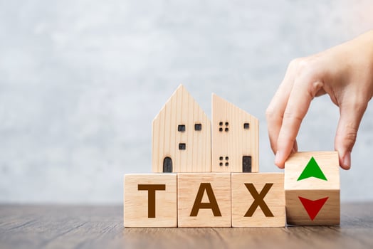 TAX block with house model. real estate, Home loan, taxation, payment and financial concept photo