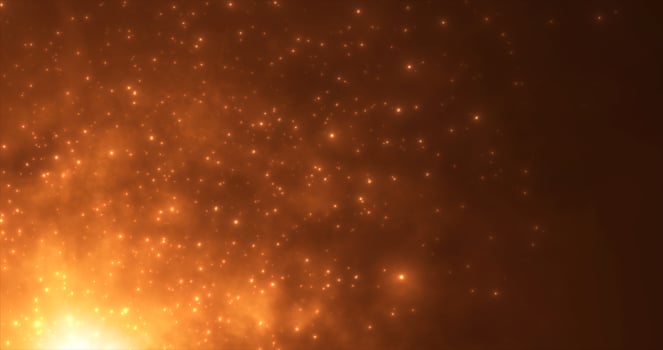 Abstract orange fiery flame bonfire of particles and sparks glowing beautiful magical on a dark background. Abstract background photo