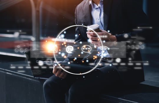 Contact us or Customer support hotline people connect. Businessman using a laptop and touching on virtual screen contact icons email, address, live chat, internet wifi . photo