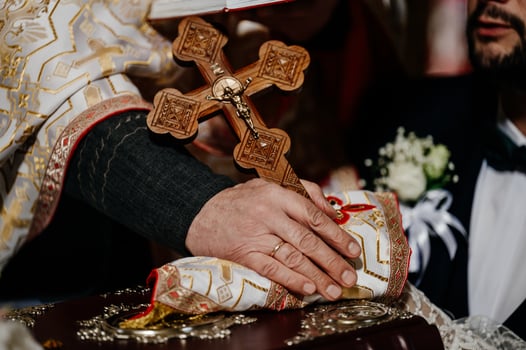 Ivano-Frankivsk, Ukraine October 2, 2021 The bride and groom hold each other's hands during a church wedding ceremony photo